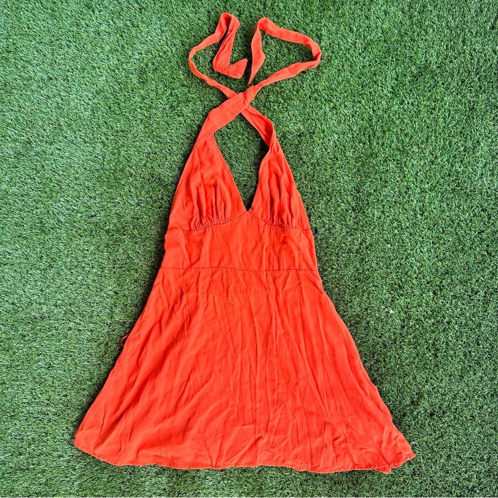 Dark red/orange triangle halter mini dress
Flowy and ties at the top